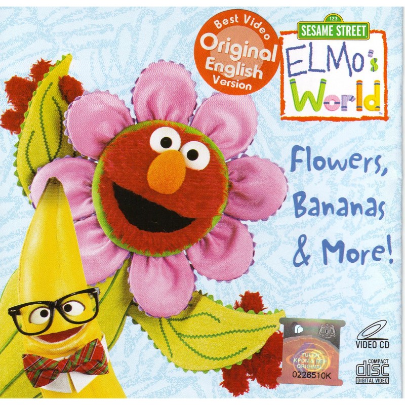 Cover of an Elmo’s World
     video DVD titled ‘Flowers, Bananas & More!’ The cover depicts
     Elmo wearing a flower costume, including a ring of flower petals
     around his head.  Below is a banana with a face, a bow tie, and a
     pair of horn-rimmed spectacles.